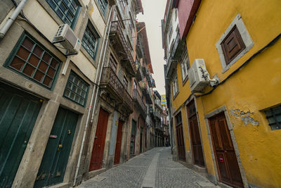 Narrow street between residential buildings