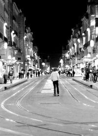 People on city street at night