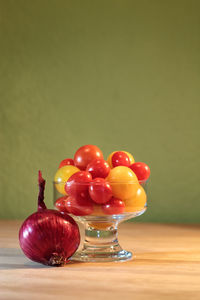 Close-up of christmas decorations against pink background