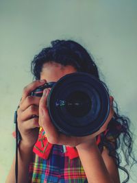 Portrait of woman photographing