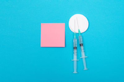 Directly above shot of blue container on table against wall