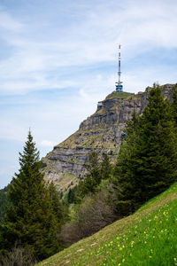 View of tower on mountain against sky