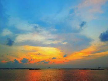 Scenic view of sea against sky at sunset