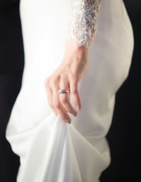 Close-up of woman over black background