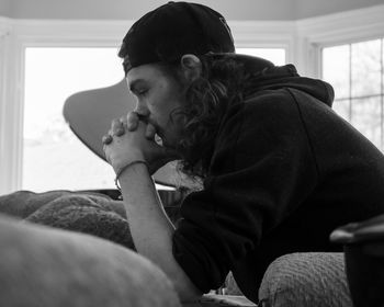 Man sitting on sofa at home