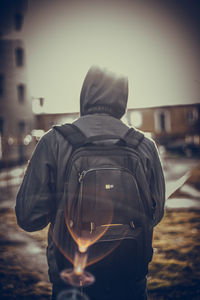 Rear view of man standing on street