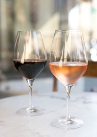 Close-up of wine glasses on table