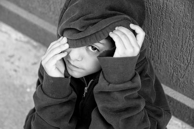 Portrait of boy wearing hood