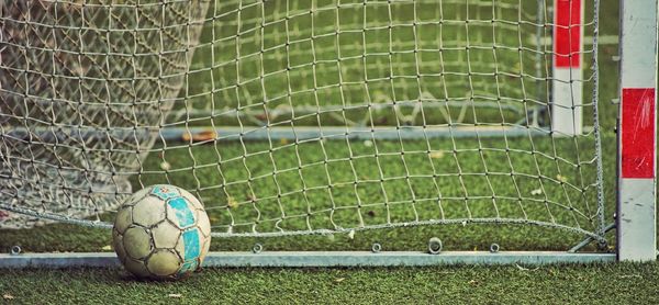 Close-up of soccer ball on field