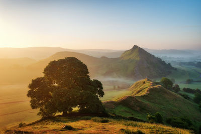 Scenic view of mountains against sky during sunset