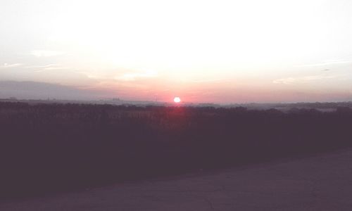 Scenic view of landscape against sky during sunset
