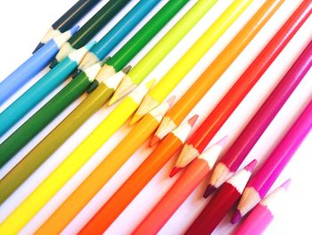 Close-up of multi colored pencils on table