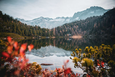 Scenic view of lake and mountains against sky