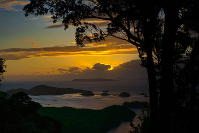 Scenic view of sea against orange sky