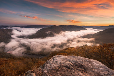 Scenic view of mountains against sky during sunset