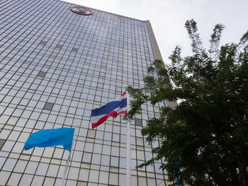 Low angle view of flag against building