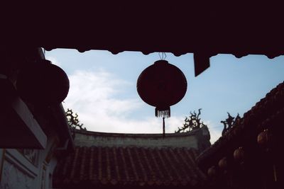 Low angle view of lantern against sky