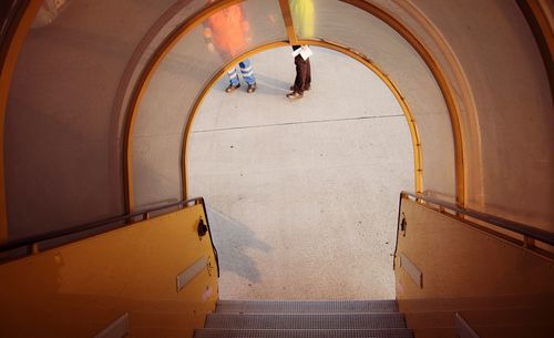 Low section of men seen from boarding stairs standing at airport