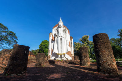 Low angle view of temple against clear blue sky
