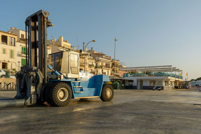 Forklift for taking boats into or out of the water in a marina