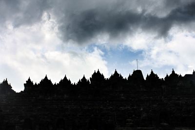 Silhouette temple against sky