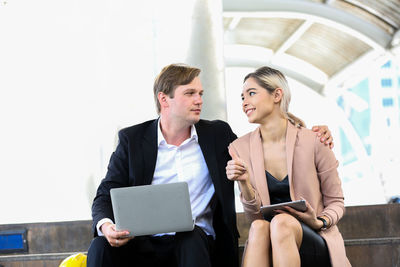 Young couple looking at camera