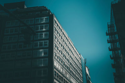 Low angle view of modern buildings against sky