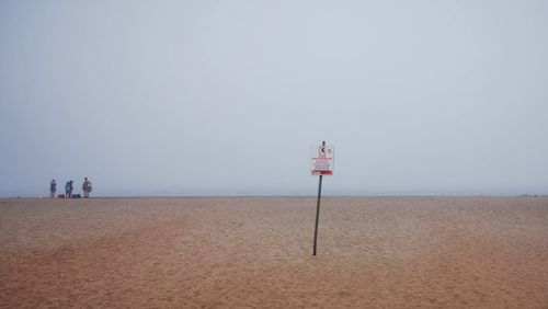 Scenic view of beach against clear sky