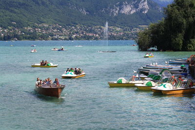 Boats in sea against sky