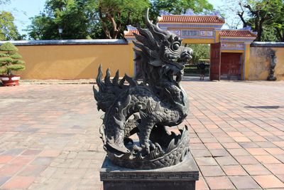 Statue against building