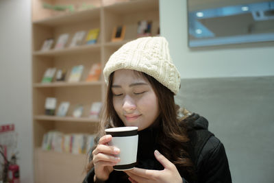 Close-up of a woman drinking coffee cup