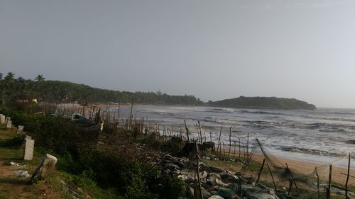 Scenic view of beach against clear sky