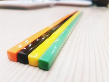 Close-up of multi colored pencils on table