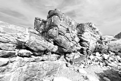 Rock formation on land against sky