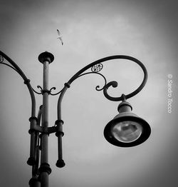 Low angle view of street light against sky