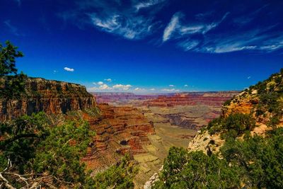 Scenic view of landscape against blue sky