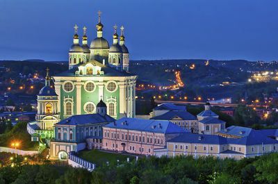 Illuminated buildings in city at night