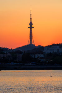 Scenic view of sea against clear sky during sunset