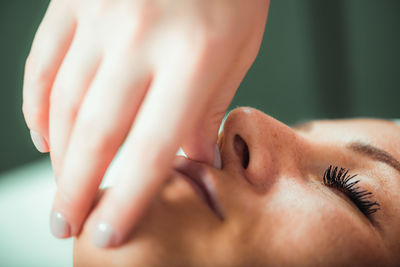 Face lifting massage, beautiful woman getting face lifting massage in a beauty salon.