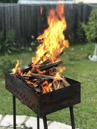 Close-up of fire burning on wood