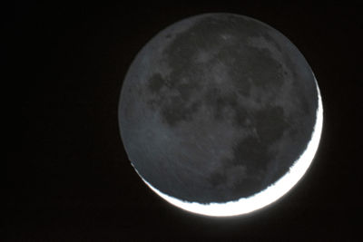 Low angle view of moon against sky at night