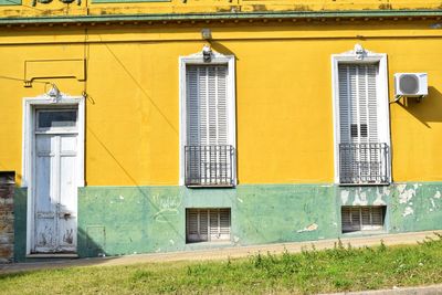 Yellow closed door of building