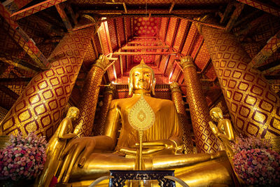 Statue in temple outside building