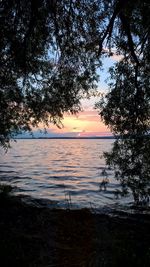 Scenic view of sea at sunset