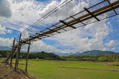 Low angle view of agricultural field against sky