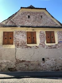 Low angle view of old building against sky