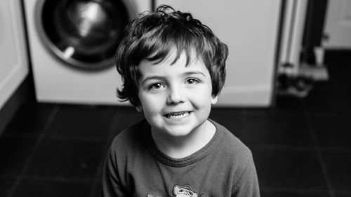 Portrait of smiling boy at home