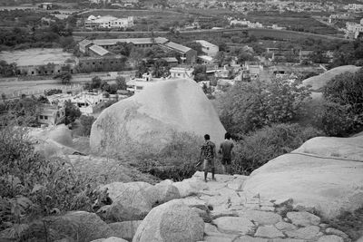 Rear view of people on rocks