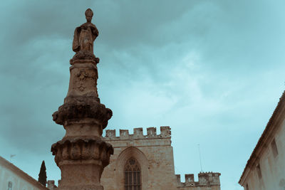 Low angle view of statue against sky