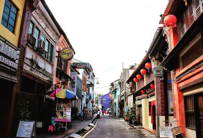 Narrow road along buildings